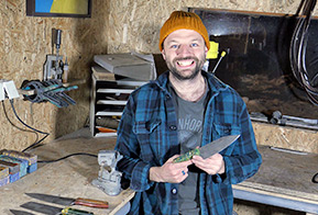 knife maker holding a kitchen knife